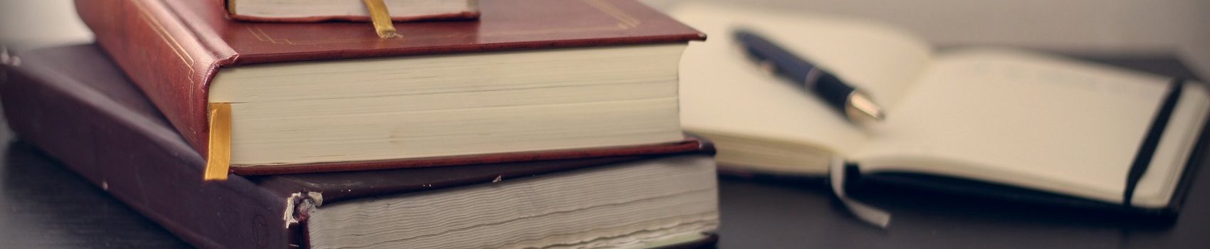The main photo for the resources page with a bunch of books.